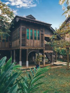 an old wooden house in the middle of some trees