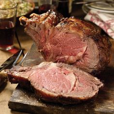 a large piece of meat sitting on top of a cutting board