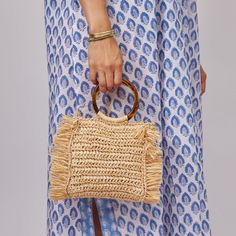 Fringed straw bag with a round tortoise handle and optional crossbody strap, our Tort bag is one of our spring and summertime favorites! Product Overview: Material: 100% Raffia; Lining- 100% Linen; Handles- 100% Plastic 17cm x 16cm: Strap Length 120cm Spot Clean with Damp Cloth Natural Fringe Rectangular Beach Bag, Luxury Summer Bags With Fringe, Luxury Fringe Top Handle Bag, Luxury Jute Straw Bag, Rectangular Shape, Luxury Bohemian Straw Bag, Rectangular Shape, Fringe Bags, Crossbody Strap, Tortoise, Straw Bag