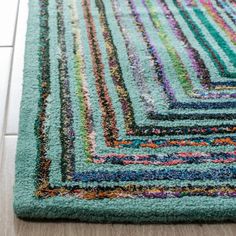 a multicolored area rug on the floor