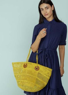 Sans arcidet's arlette bag is an openwork basket bag and features hand sewn raffia braids and a reinforced synthetic leather handle.    measures approximately 19.5" x 11.5" x 10.5".    color citron. 100% raffia. handle 88% polyurethane 8% polyester 2% cotton 2% leather. made in madagascar. Top Handle Beach Bag With Braided Handles For Shopping, Shopping Beach Bag With Braided Top Handles, Shopping Beach Bag With Top Handle And Braided Handles, Yellow Top Handle Shoulder Bag With Braided Handles, Chic Yellow Crochet Tote Bag, Top Handle Open Weave Shoulder Bag For Shopping, Summer Woven Leather Bag With Round Handle, Yellow Woven Top Handle Shoulder Bag, Summer Straw Bag With Woven Leather And Round Handle