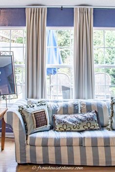 a living room filled with furniture and a flat screen tv