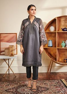 2 Piece Embroidered Suit for Women (Shirt & Trouser) Description : Organza strip kurta with grey base and a pop of colorful floral embroidery. Fabric : Shirt fabric is Organza stripe. Trouser fabric is Raw Silk. Gray Embroidered Kurta For Eid, Embroidered Gray Kurta For Eid, Festive Gray Embroidered Kurta, Festive Embroidered Gray Kurta, Embroidered Suit, Shirt Trouser, Suit Shirts, Embroidery Fabric, Grey Women