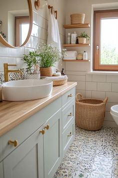 a bathroom with a sink, toilet and window