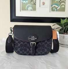 Signature denim and soft pebble leather Fabric lining Detachable strap with 25.5" drop for shoulder or crossbody wear Outside open pocket Inside multifunction pocket Snap closure Length: 9.25" Height: 7.0" Width: 3.25" CQ185 ALL ITEMS ARE GUARANTEED 100% AUTHENTIC AND BRAND NEW! Condition is new with tags. Shipped with USPS priority or first class mail and UPS ground. Please note that the color in pictures might differ slightly due to lighting, flash and screen resolution. In a smoke and pet free home Saddle Bag, Leather Fabric, Colorful Pictures, Pebbled Leather, Saddle Bags, Snap Closure, Inside Pocket, Saddle, Flash