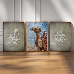 three framed paintings depicting camels in arabic calligraphy on wood floor next to wall