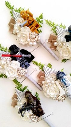 three star wars themed hair clips with flowers on them