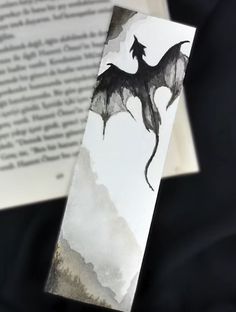 a bookmark with an image of a dragon on it