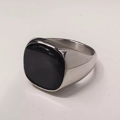 Handcrafted Mens Square Black Onyx Silver Tone Signet Ring - Stone Dimensions: Square 14*14 - Band New With Tags! - Limited Quanity -100% Authentic - Full Retail Package With All Accesories Classic Black Adjustable Signet Ring, Adjustable Black Signet Ring With Polished Finish, Masculine Black Stainless Steel Jewelry, Masculine Black Jewelry For Gift, Formal Black Stainless Steel Signet Ring, Masculine Silver Stainless Steel Jewelry, Masculine Stainless Steel Silver Jewelry, Masculine Silver Jewelry Gift, Elegant Black Stainless Steel Signet Ring