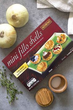 the ingredients to make mini filo shells are laid out next to garlic and herbs