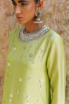 Editor's Note Featuring a green Hand Embroidered Kurta Set in Chanderi. Color: Green Fabric: Chanderi Care: Dry Clean Only About the Designer Modernizing Indian wear with rich handwoven textiles, fresh intricate textures, chic and classic silhouettes, Saksham & Neharicka handcraft all designs to eternal perfection. Their soulful stories are inspired by nature, mythology and popular culture. Embroidery Quotes, Hoops Embroidery, Indian Outfits Modern, Cotton Night Dress, Flower Machine Embroidery Designs, Kurta Set For Women, Iranian Women Fashion, A Line Kurta, Embroidery Neck Designs