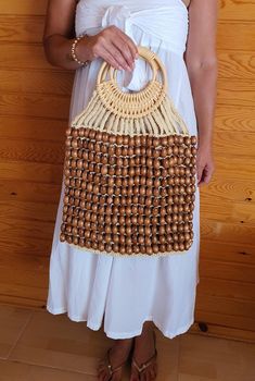 Hello dear welcome to my store. My bag are 100% handmade. These specially designed bag each of which is handmade. It is knitted from luxurious wood beads. Material : Wood beads, macrame, straw rope Measurements :  H 52 cm W 37 cm Gift for Women, Wood Beads Bag, Macrame Bag Bohemian Beaded Crochet Bag In Natural Color, Everyday Beaded Rectangular Straw Bag, Everyday Beaded Crochet Tote Bag, Beaded Rectangular Straw Bag, Natural Beaded Bag As Gift, Natural Beaded Bag Perfect For Gifts, Natural Beaded Bags Perfect For Gifts, Bohemian Beaded Natural Color Bag, Natural Rectangular Bag With Wooden Beads