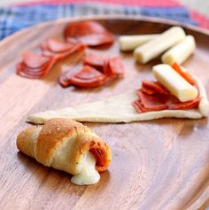 some food is laying out on a wooden plate