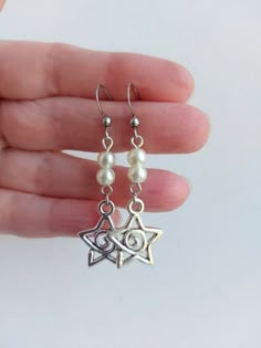 The earrings are decorated with star-shaped pendants with a spiral. The earrings use faux pearl beads The earrings are fastened with stainless steel hooks. Earring length - 6.0 cm (2.4 inches) Earrings are packed in a gift box RECOMMENDATIONS FOR CARE: Do not wet, do not drop, and store in a dark box! - Remove jewelry before exercising, swimming, showering and sleeping. - Avoid contact with moisture such as make-up, moisturizer, lotion, perfume and hairspray. - Store your jewelry in a box or pou Cottagecore Indie, Y2k Jewelry, Funky Earrings, Faux Pearl Earrings, Jewelry Accessories Ideas, Fairycore Cottagecore, Dope Jewelry, Funky Jewelry, Fancy Jewelry