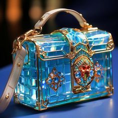 This digital artwork showcases a truly unique designer handbag, a masterpiece of luxury and craftsmanship. The handbag's most striking feature is its primary structure, meticulously crafted from translucent, azure blue stained glass panels. This rare material gives the handbag a jewel-like quality, reflecting light and depth in a way that is truly unmatched. Adorning the glass are intricately detailed brass elements, not only providing structural support but also enhancing the handbag's ornamental beauty. These brass details are fashioned into elaborate designs, reminiscent of art deco motifs, and are meticulously polished to a high sheen, reflecting light with a golden radiance. Luxury Rectangular Case Bag As Gift, Luxury Rectangular Bags For Gifts, Designer Rectangular Shoulder Bag For Gift, Luxury Rectangular Shoulder Bag As Gift, Luxury Rectangular Shoulder Bag For Gift, Modern Rectangular Shoulder Bag As Gift, Luxury Shoulder Bag As Gift, Designer Satchel Shoulder Bag As Gift, Modern Rectangular Bags For Gifts