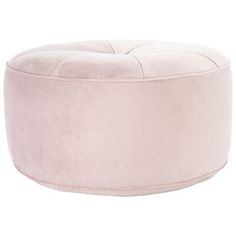 a round pink ottoman sitting on top of a white floor