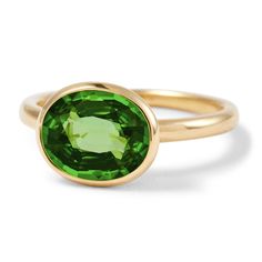 This incredible, exclusive piece is only available when our gemologist is able to source these bright forrest green tourmalines. This gemstone has a divine verdant hue, full of mystery and desire. Its oval cut measuring 10mm x 8mm brings out its unique tones and natural variations. Set in 18 carat gold with an open back to reflect and refract the light. Gemstone carats can vary. These rings are individual special editions and as a result gemstone weights can vary slightly from piece to piece. Co Stone Rings Design, Gem Stone Rings, Necklace Design Ideas, Funky Jewellery, Copper Accessories, Faceted Design