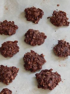 chocolate cookies are arranged on a baking sheet