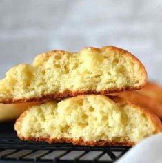 two pieces of bread sitting on top of a cooling rack next to another piece of bread