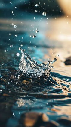 the water is splashing on top of the rocks in the ocean, making it appear to be floating