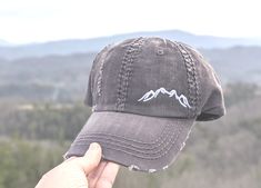 Need to change this cap design to a messy bun/high ponytail cap style, a non-distressed baseball cap or kid's baseball cap? Once you have this cap in your cart, head here: https://etsy.me/2S82fka Distinct Headwear Presents... 🌄Women's Embroidered Mountain Shape Silhouette Hat All hats are embroidered in the Smokies of East Tennessee. 🏞️Main Photo Shows: dark grey cap with white mountains. Order as shown or choose your cap and mountains thread color. Need this design with custom text? https://e Embroidered Mountains, Baseball Mom Hat, Bun High, Cricket Crafts, Camping Hat, Cc Hats, Mountain Hat, Ponytail Cap, Kids Baseball Caps