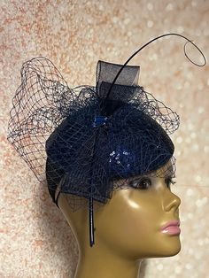 Navy Blue Sequins Sinamay fascinator. Accented with bows, hat pin and rhinestones. Perfect for church, tea parties, weddings, and special occasions. The hat affixes to the head by a hat elastic. Sizes 6 inches in diameter  7 inches in diameter 8 inches in diameter Handmade Gifts for mom, sister, wife, or yourself. PLEASE NOTE All items for Free Shipping will be shipped via USPS First Class Mail. Blue Adjustable Headpiece With Pinched Crown, Blue Evening Headpiece For Royal Ascot, Elegant Blue Fascinator For Formal Occasions, Adjustable Blue Headpiece With Pinched Crown, Elegant Blue Costume Hat For Evening, Adjustable Gatsby Style Fascinator For Formal Occasions, Blue Party Headpiece With Pinched Crown, Royal Blue Mini Hats For Royal Ascot Evening, Elegant Blue Fascinator For Evening