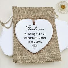 a white heart shaped ornament with the words thank you for being such an important piece of my story