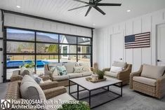 a living room filled with furniture next to a swimming pool