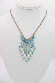 This beautiful vintage bib necklace has genuine White Pearls with Crystal, Sterling Silver and turquoise beads. This necklace is really pretty and unusual, the pearl tassels run in a graduated size. The necklace is just over 17 inches in length. Signed 925 on the dolphin shaped clasp. Please see photos for approximate measurements and further details. NOTE: Items in photographs may appear larger or smaller than actual size. Please make sure to check the item descriptions and all photographs care Pearl Tassels, Pearl Bib Necklace, Bib Necklaces, Sunset Beach, Bib Necklace, Agate Gemstone, Turquoise Beads, White Pearl, Art Deco Fashion