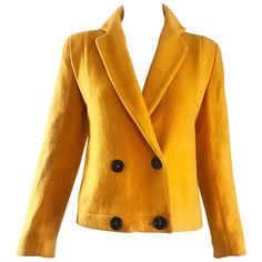 Chic 90s GEOFFREY BEENE for LORD & TAYLOR marigold mustard yellow virgin double breasted wool cropped blazer jacket! Features super soft virgin wool. Full lined, with pockets at each side of the waist. Four black buttons up the front. Great with jeans, a skirt or over a dress. In great condition. Made in USA Approximately Size Medium Measurements: 36-38 inch bust 32 inch waist 23 inches from top back center collar to hem Mustard Blazer, Yellow Clothes, Yellow Blazer, Cropped Blazer Jacket, Geoffrey Beene, Crop Blazer, Collar Jacket, Vintage Blazer, Cropped Blazer