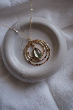 This unique piece is designed with a captivating teardrop  pendant, invoking the timeless beauty of a tranquil beach and the mysterious, untamed spirit of the sea. The necklace is a testament to delicate beauty, embodying the essence of a serene beach in a chic and stylish piece of jewelry. Each necklace is carefully crafted with gold-filled material, which imparts a warm glow and enduring charm. Ethereal Teardrop Jewelry As Gift, Ethereal Teardrop Jewelry Gift, Nature-inspired Teardrop Necklace For Healing, Nature-inspired Teardrop Necklace With Natural Stones, Nature-inspired Teardrop Natural Stones Necklace, Bohemian Teardrop Pendant Drop Necklace Gift, Bohemian Teardrop Crystal Necklace For Gift, Nature-inspired Gold Teardrop Pendant Jewelry, Gold Teardrop Wire Wrapped Necklace