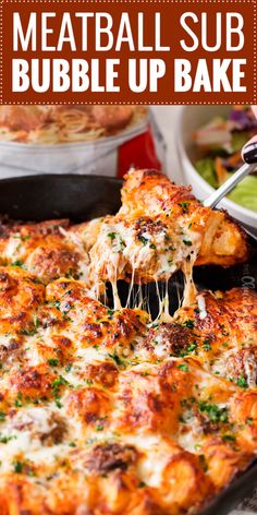 meatball sub bubble up bake is being lifted with a spatula