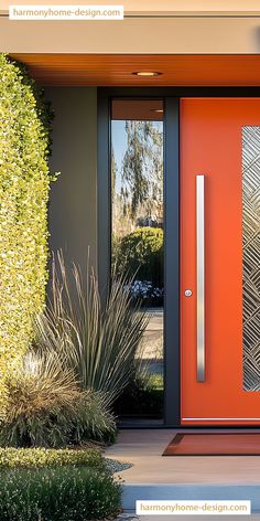 an orange front door with two sidelights and decorative plants in the foreground next to it