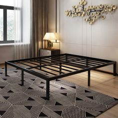 a black and white bed frame in a room