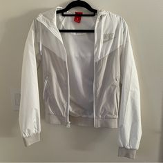 New Without Tags. Cream/Tan Color. Size Xs. White Hooded Windbreaker For Running, Casual Nike Outerwear For Workout, White Sportswear Windbreaker For Running, White Sporty Nylon Outerwear, Sporty White Nylon Outerwear, White Nylon Sports Outerwear, White Nylon Outerwear For Sports, White Long Sleeve Track Jacket For Running, White Nike Track Jacket Functional