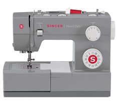 the singer heavy duty sewing machine is grey with red and white numbers on it's buttons