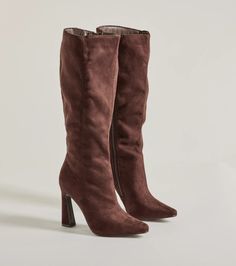 Chic and on-trend, these faux suede boots feature an under-the-knee height to stylishly pair with mini dresses, pants, or leggings. They feature a pointed toe, a complete inner zipper closure for effortless styling, and an asymmetric block heel.Fit & FeaturesAsymmetric block heelFaux suede materialUnder-the-knee heightPointed toeComplete inner zipper closureRuns true to size Trendy Fitted Suede Knee-high Boots, Tall Suede Knee-high Boots For Winter, Fitted Suede Knee-high Boots For Work, Wide Calf Suede Knee-high Boots For Party, Winter Knee-length Heeled Boots For Workwear, Knee-length Heeled Boots For Winter Workwear, Winter Workwear Tall Mid-calf Boots, Fitted Suede Knee-high Boots For Fall, Mid-calf Knee-high Boots For Winter Workwear