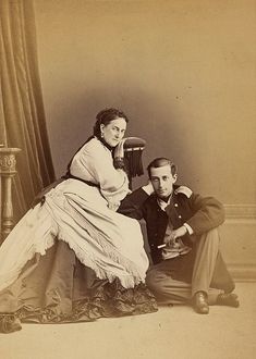 an old fashion photo of a man and woman