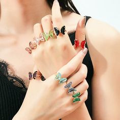 Description: Chic Zirconia Butterfly Ring Specifications: Size: #7 adjustableWeight: 0.11 oz/pcsMaterial: Zircon, Copper, 18k GoldColor: red/pink/purple/green/white/black/amber/turquoise Add a touch of whimsy and elegance to your everyday attire with our Chic Zirconia Butterfly Ring! Crafted with sparkling zirconia stones, this ring will surely catch anyone's eye. Embrace your inner fashionista with this must-have accessory. Fly high with style! 🦋✨ Band Rings Women, Rose Violette, Butterfly Pendant Necklace, Butterfly Ring, Crystal Accessories, Enamel Bracelet, Butterfly Jewelry, Butterfly Pendant, Exquisite Jewelry