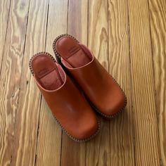 Like New - Worn Once Orange Mules With Removable Insole And Round Toe, Orange Round Toe Clogs With Rubber Sole, Casual Orange Clogs With Rubber Sole, Spring Orange Closed Toe Mules, Orange Closed Toe Leather Clogs, Orange Leather Closed Toe Clogs, Spring Orange Round Toe Mules, Orange Closed Toe Clogs With Rubber Sole, Casual Orange Clogs With Round Toe