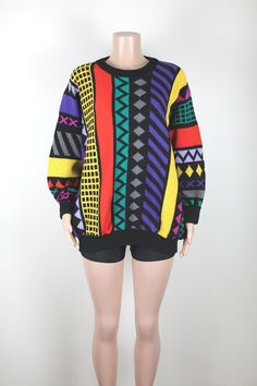 This 80s Jumper is a hand knit one of a kind.  It is made from Australian Merino Wool, is crazy colourful, bright, eye catching and super soft and warm.  Perfect for adding a bit of something extra to any Winter look. Brand: Handmade.  Fabric: Rainbow Merino Wool Colour: Black and Rainbow.  Brand: Anchor Blue. Size & Measurements: This jumper is a size 16 Australian Womens, and also looks incredible when worn over-sized. Retro Knitted Acrylic Sweater, Retro Multicolor Knit Sweater, Retro Multicolor Acrylic Sweater, Vintage Multicolor Hand Knitted Sweater, Vintage Hand Knitted Multicolor Sweater, Vintage Multicolor Hand-knitted Sweater, Vintage Multicolor Knitted Sweater, Vintage Multicolor Jacquard Knit Sweater, Vintage Multicolor Acrylic Sweater