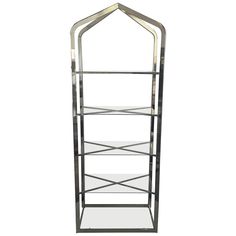 a metal shelf with glass shelves on each side and an arched design at the top