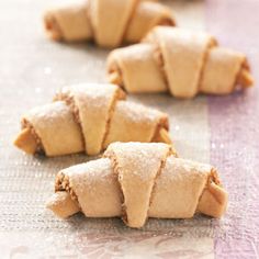 small pastries are lined up on a table