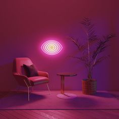 a chair and table in a room with a pink light on the wall behind it