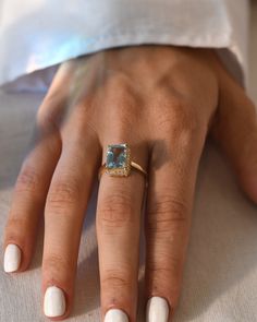 DetailsMaterial: 14k/18k goldColor Options: Yellow Gold, White Gold, Rose Gold★ Center StoneAquamarine, OctagonSize: 7.30 x 9.85mmApprox Weight (Ct): 2.9★ Accent StonesDiamond RoundSize: 1.3 mm * 26 Nos.Approx Weight (Ct): 0.182 Emerald Cut Aquamarine Rings With Gemstone Accents, Gold Aquamarine Ring With Gemstone Accents, Yellow Gold Aquamarine Ring With Gemstone Accents, Yellow Gold Aquamarine Rings With Gemstone Accents, Future Engagement Rings, Aquamarine Engagement Ring, Natural Gemstone Jewelry, Aquamarine Ring, 18k Gold Ring