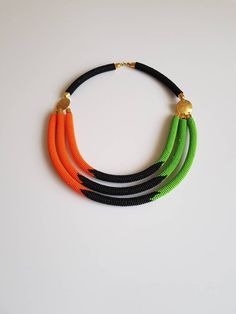 100% handcrafted using original fine beads. *Comes with matching earrings and 2 bracelets. The necklace is 18 inches long( round the neck). Each section is attached to one another nicely. S hook clasp is used for closure. **Buy multiple items and pay shipping for 1 item only.The rest ships free. More neckleces here; https://www.etsy.com/shop/TribalTess?ref=seller-platform-mcnav&section_id=21306083 Back to my shop; https://www.etsy.com/shop/TribalTess?ref=seller-platform-mcnav Handmade Multi-strand Orange Beaded Necklaces, Black Beaded Necklace With Colorful Beads, Adjustable Orange Necklaces With Black Beads, Adjustable Orange Necklace With Black Beads, Orange Necklace With Black Round Beads, African Beads Necklace, Orange Necklace, S Hook, African Necklace