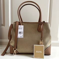 Nwt Michael Kors Mercer Gallery Pale Gold Center Zip Tote. 100% Cotton Trim: 100% Leather Pale Gold-Tone Hardware 13"W X 10"H X 5.5"D Handle Drop: 6.5" Adjustable Strap: 17"-20" Interior Details: Center Zip Compartment With Back Zip Pocket, Back Slip Pocket, 4 Front Slip Pockets Lining: 100% Polyester Magnetic Snap Fastening Dust Bag Not Included Imported Style # 30h8mz5t6c Gold Tote Bag, Mom Tote Bag, Michael Kors Mercer, Zip Tote, Pale Gold, Michael Kors Bag, Interior Details, Womens Tote Bags, Tory Burch