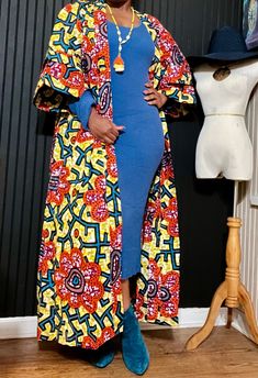 Thema in Ghanian culture means "Queen." Become a walking testament of the Queen you are and exude the beauty of culture and colors in our beautiful Ankara print kimono! Dress with ease by pairing with your favorite staple piece, sandals, heels or sneakers to dramatize or play down. A great vacay piece and garment for year round wear! One size fits most up to size 24, tall girl friendly, model is 5'6, wearing 4" heels. Colors: Multi (teal, citrine, purple, orange, black). Multicolor Print Kimono With Vibrant Print And Kimono Sleeves, Oversized Multicolor Long Sleeve Kimono, Multicolor Long Sleeve Oversized Kimono, Multicolor Oversized Long Sleeve Kimono, Culture Meaning, Multicolor Long One-size Kimono, Print Kimonos, Tall Girl, Kimonos