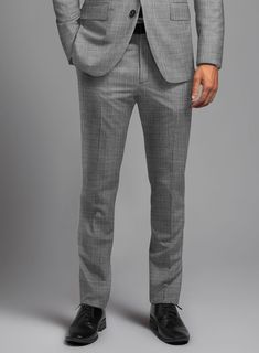 Express your unique flair and grace with the London Loom Gray Eufemia Wool Silk Linen Pants. Crafted from a harmonious blend of premium wool, luxurious silk, and breathable linen, this ensemble ensures both comfort and elegance. The distinguished shade of gray and solid pattern are accentuated by impeccable craftsmanship. Seamlessly transitioning from high-stakes boardroom presentations to exclusive social gatherings, this pants serves as a symbol of distinction and refinement.   The London Loom Collection  masterfully blends the durability of wool, the luxury of silk, and the breathability of linen, reflecting the elegance of English tailoring. This fabric offers season-spanning comfort, refined drapes, and natural coolness. Woven with traditional expertise, it stands as a testament to qu Fitted Linen Pants For Formal Occasions, Luxury Fitted Full-length Dress Pants, Tailored Long Pants For Formal Occasions, Elegant Tailored Wool Bottoms, Elegant Slim Fit Suiting Fabric Pants, Fitted Suits With Long Pants For Formal Occasions, Elegant Slim Fit Pants In Suiting Fabric, Elegant Slim Fit Suiting Pants, Luxury Fitted Trousers Suits