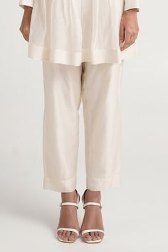 Natural white kurta with pleat details and floral embroidered sleeves. Paired with a straight pant. - Aza Fashions Traditional Festive Linen Pants, Festive Traditional Linen Pants, Elegant White Bottoms For Eid, White Cotton Pants For Eid, White Pants For Eid, White Kurta For Eid Workwear, White Kurta For Workwear And Eid, White Kurta, Embroidered Sleeves